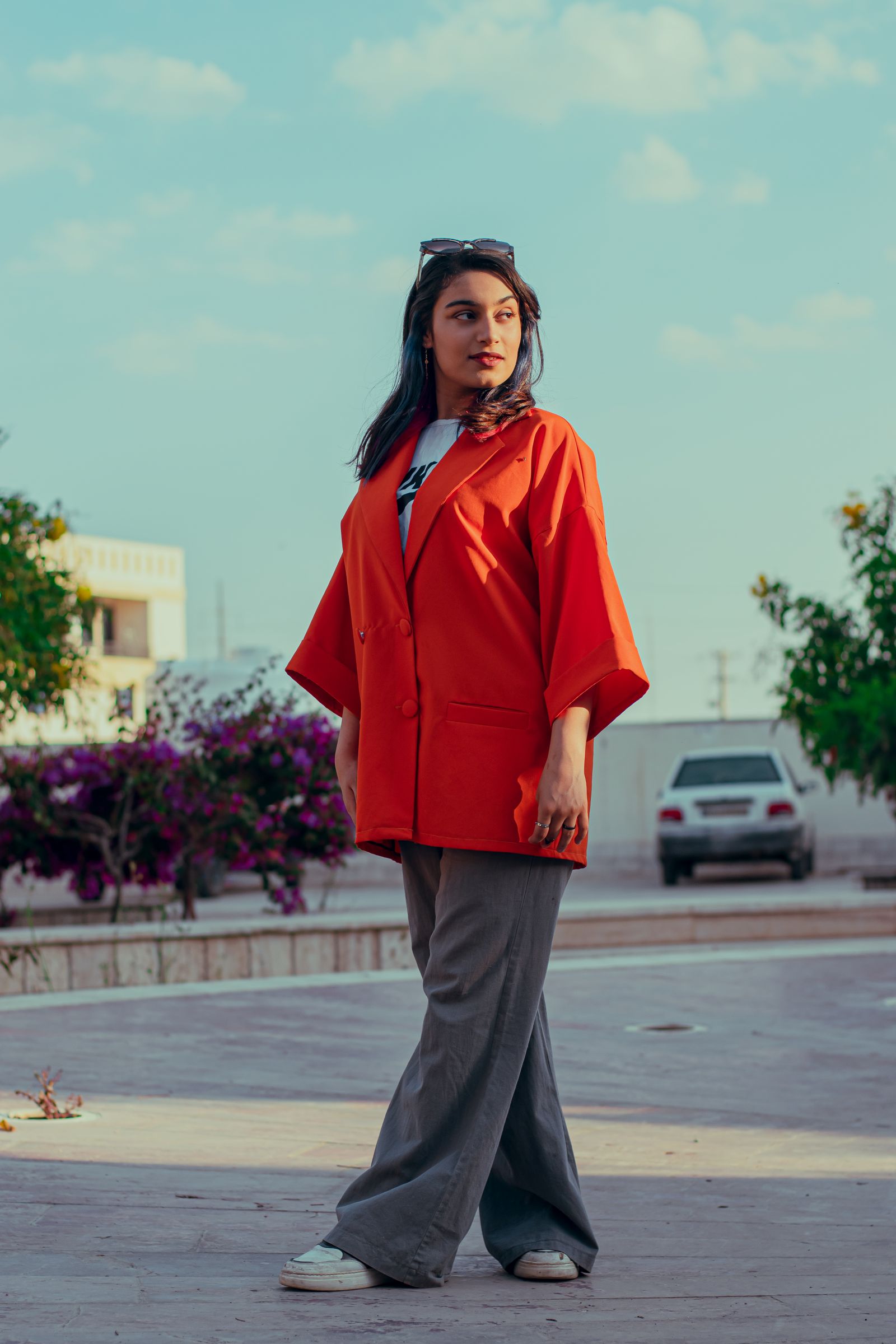 A person in an orange jacket outdoors